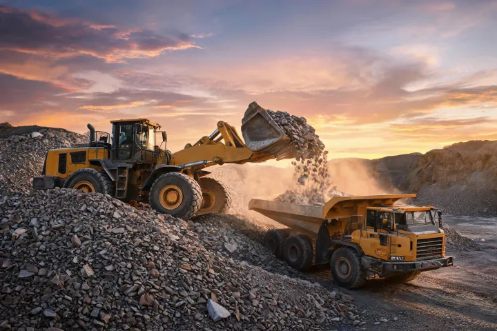 Flagship wheel loader loading hauler on quarry stockpile